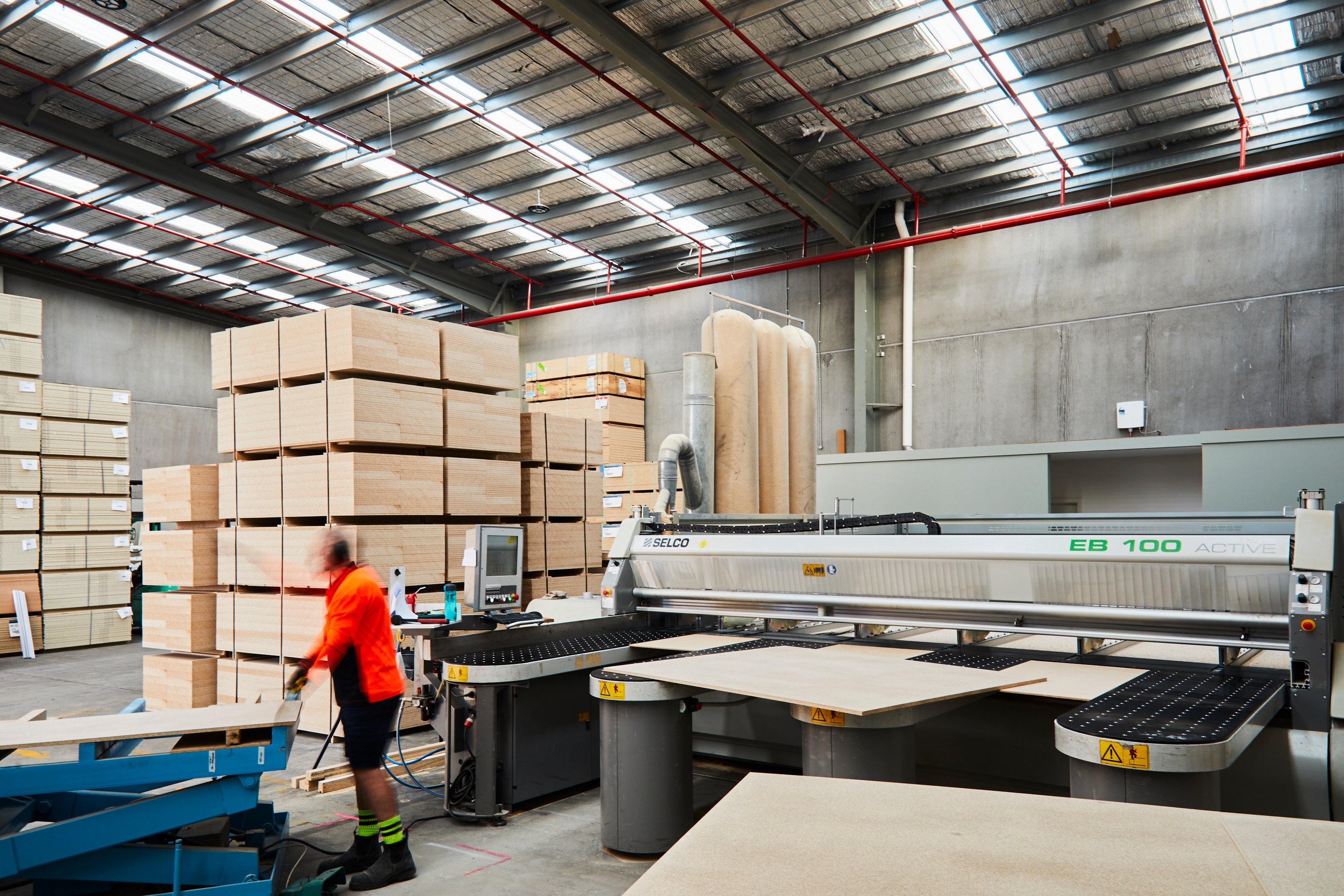 Stacked particleboard displayed on the manufacturing floor of Plyco Mornington