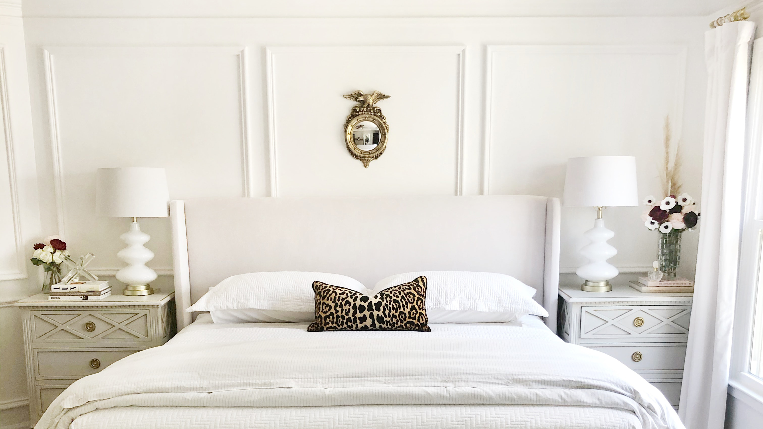 White decorative wall cladding used as a bedroom headboard